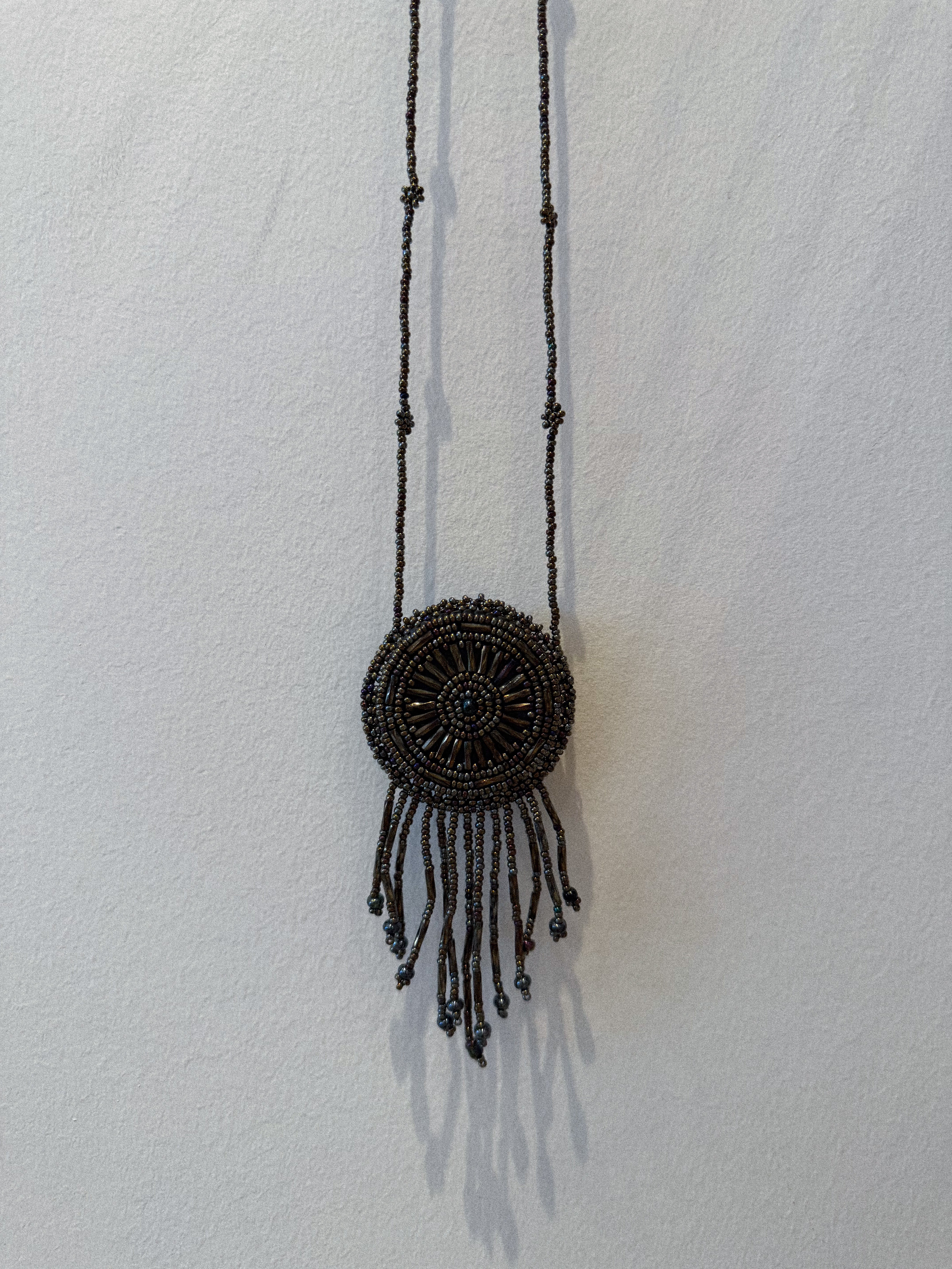 BEADED MEDALLION NECKLACE IN METALLIC GUNMETAL
